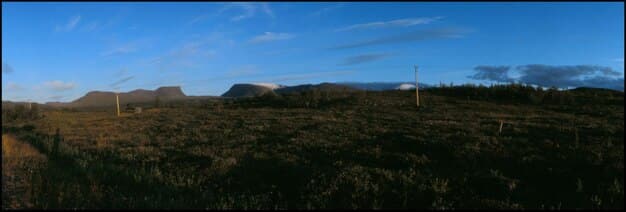 A panoramic view of a significant location in [Dorama Title] that conveys the atmosphere of the drama. This could be a bustling cityscape, a serene rural landscape, or an opulent setting, depending on the drama's genre and setting.