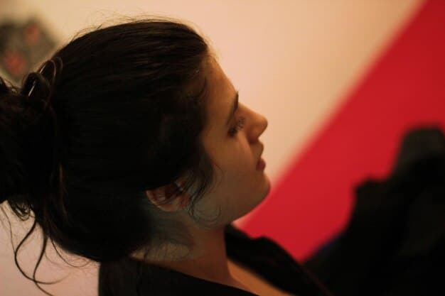 A close-up shot of the leading actress in *, portraying a moment of deep contemplation with soft lighting highlighting her expressions. The scene evokes a sense of mystery and intrigue, emphasizing the complex emotions of her character within the storyline.