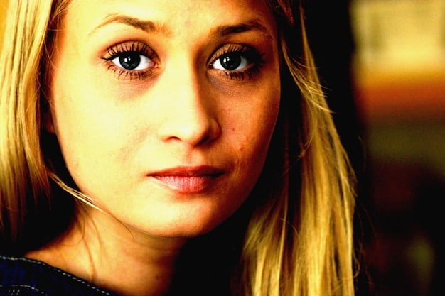 A close-up shot of the female lead in *, showcasing her expressive eyes as she experiences a moment of emotional turmoil.