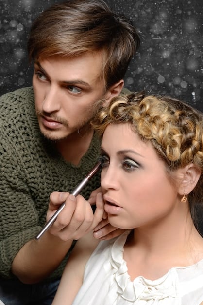 A close-up shot of makeup artists carefully applying makeup to an actress on a Dorama set. The focus is on the precision and detail of the makeup work, illustrating the level of artistry involved in Dorama production.