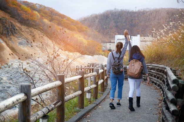 A photograph of Petite France in Gapyeong, South Korea, crowded with tourists exploring the village and taking pictures.