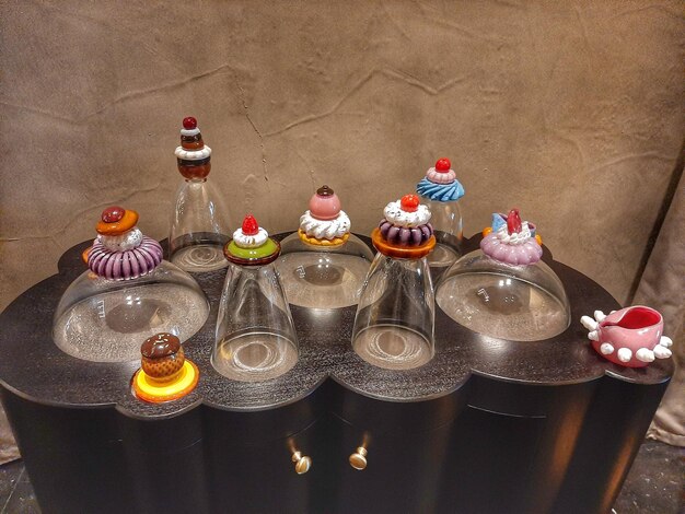 A selection of colorful and intricately decorated desserts and beverages at a dorama-themed cafe. Each item is inspired by a specific K-drama, with unique names and presentation that reflect the show's themes and characters.