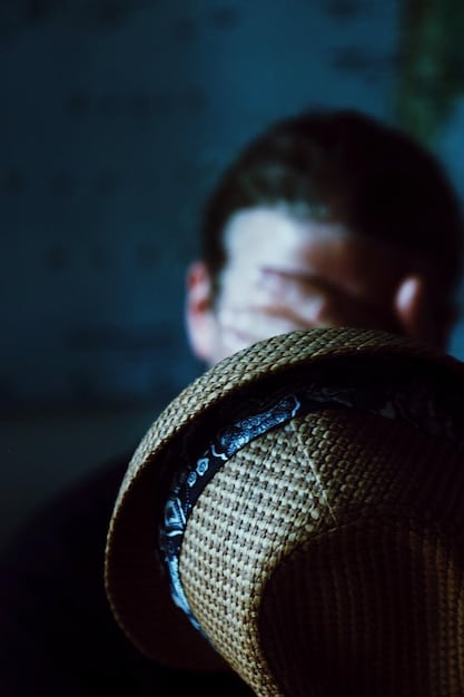 A close-up shot of a detective character in a dorama, looking determined and focused amidst crime scene evidence. The lighting is dramatic with shadows emphasizing the intensity of the scene.