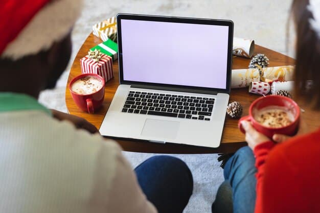 A person using a laptop to browse K-dramas on Viki, with various drama posters visible on the screen and a cup of coffee on the desk.